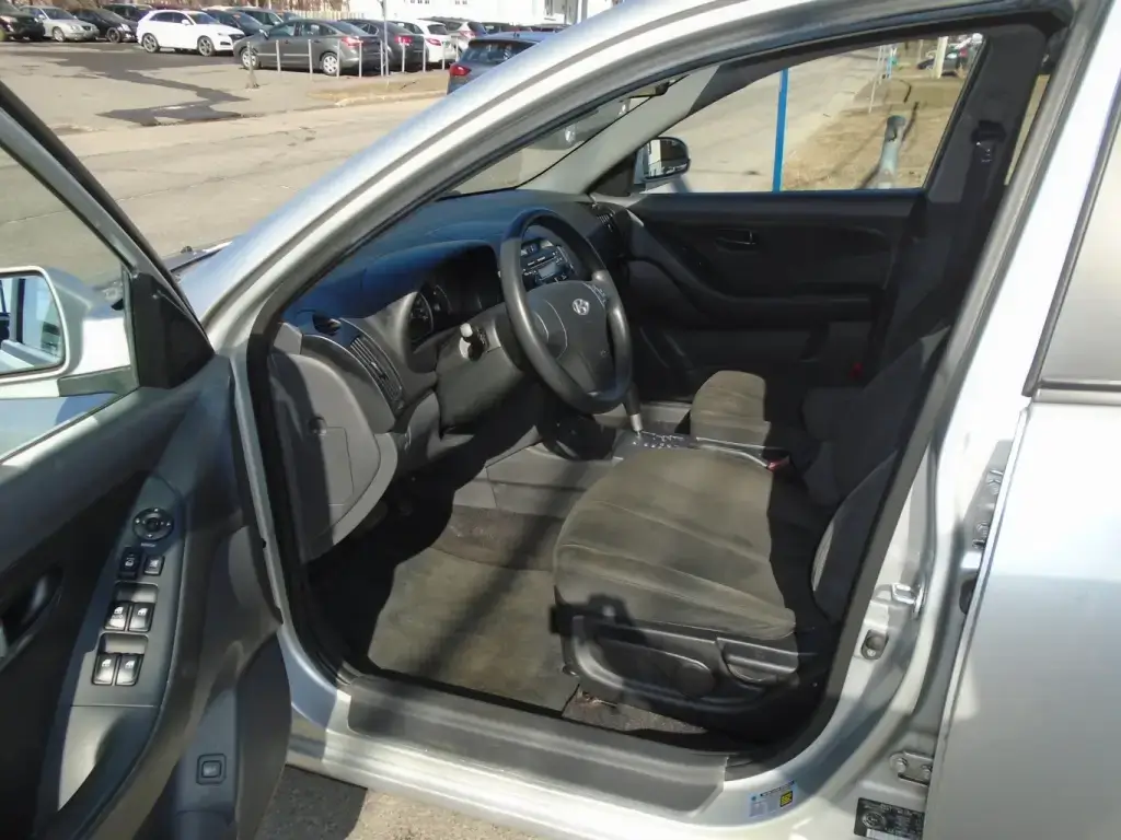 Interior view of the 2009 Hyundai Elantra, showing the dashboard, seats, and center console layout.