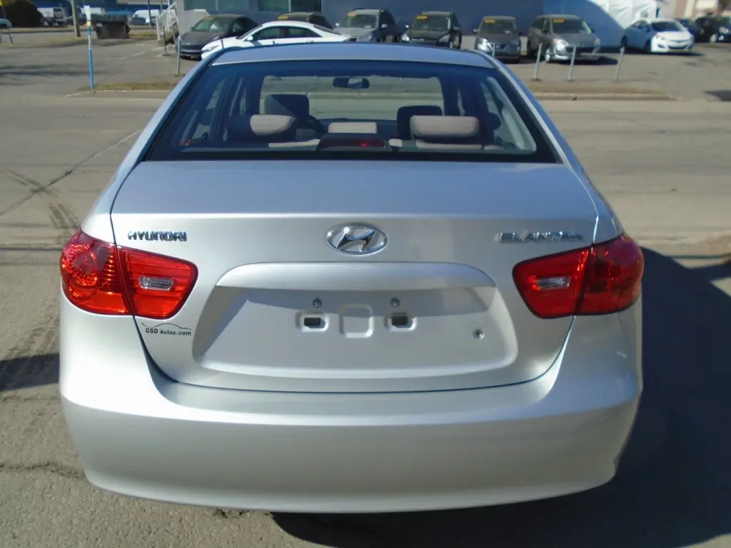 Rear view of the 2009 Hyundai Elantra, showcasing the taillights, trunk design, and compact silhouette.